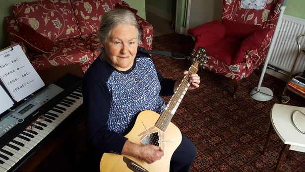 87-year-old learns to play both guitar and piano turning her into an online sensation